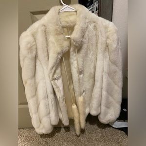 White faux fur coat with tassels